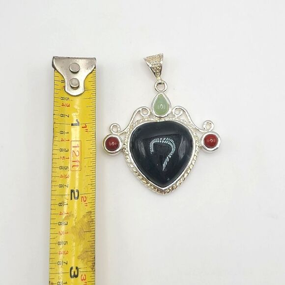 Elegant Silvertoned Pendant with Black and Red Accents - Picture 3 of 5